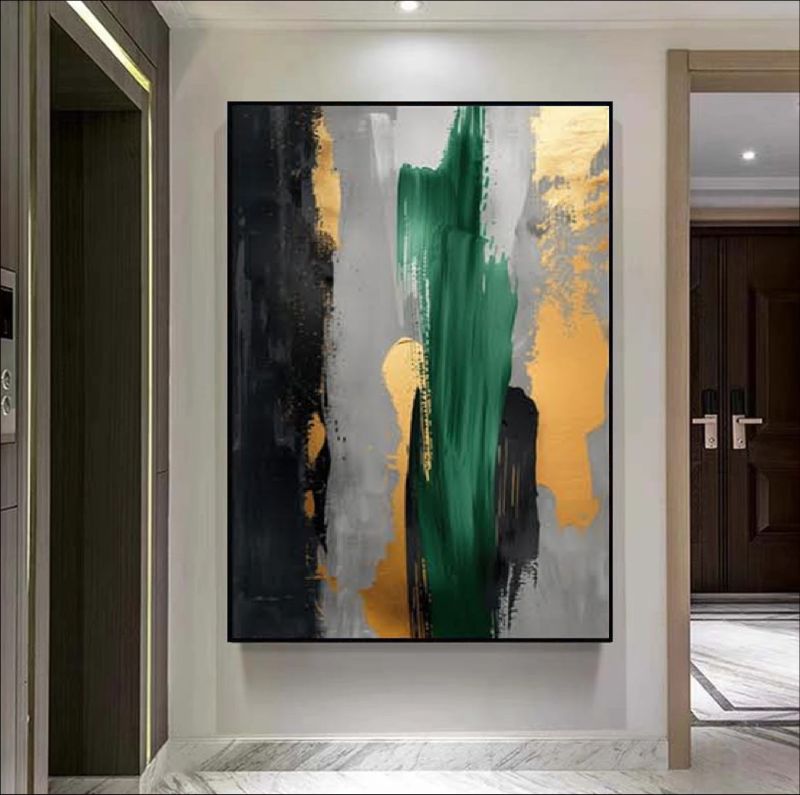 Abstract art painting with green, gold, and black colors on a wall in a modern interior setting.