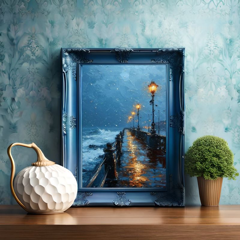 Framed artwork of a rainy street scene with decorative elements on a wooden surface.