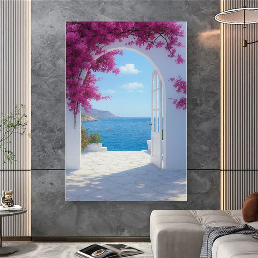 A dreamy coastal view framed by a white arched doorway and vibrant pink bougainvillea, overlooking a calm blue sea