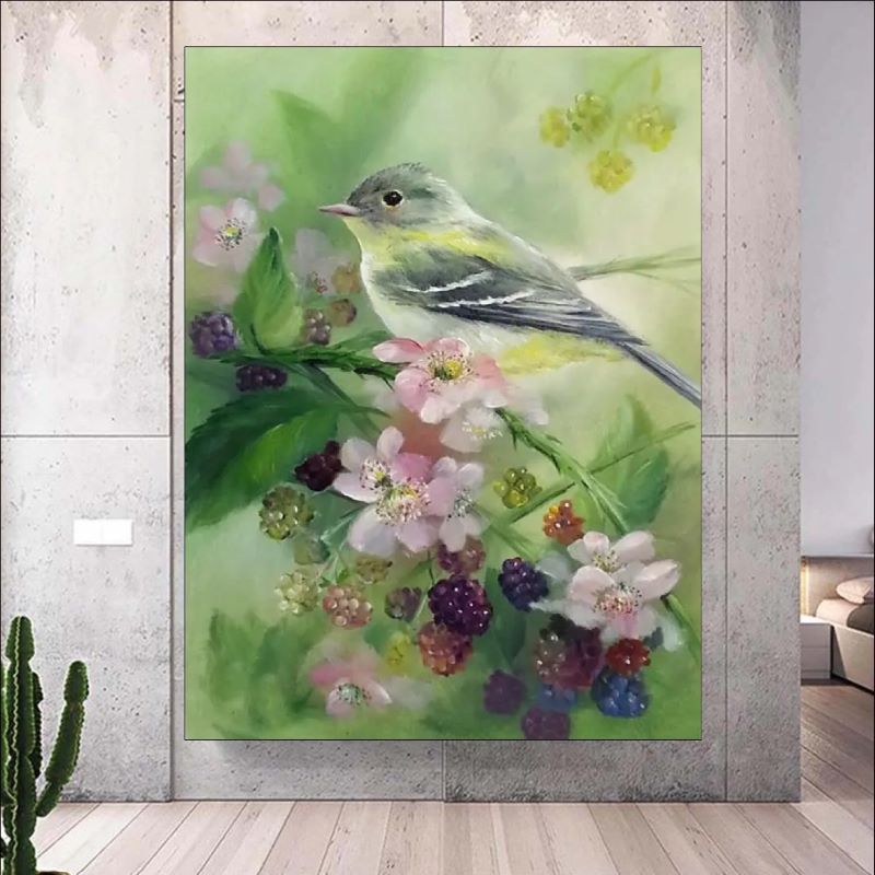 Realistic oil painting of a small grey and yellow songbird perched on a branch with pink blossoms and ripening blackberries against a soft green background.
