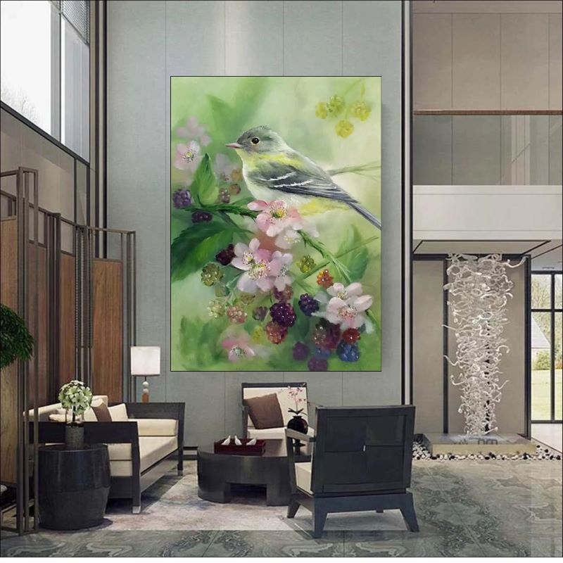 Realistic oil painting of a small grey and yellow songbird perched on a branch with pink blossoms and ripening blackberries against a soft green background.