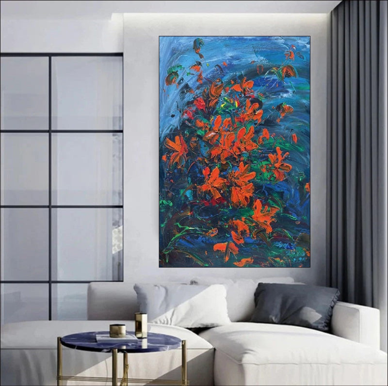 Handmade painting of red flowers on a blue background with textured brushstrokes, perfect for nature-inspired decor.