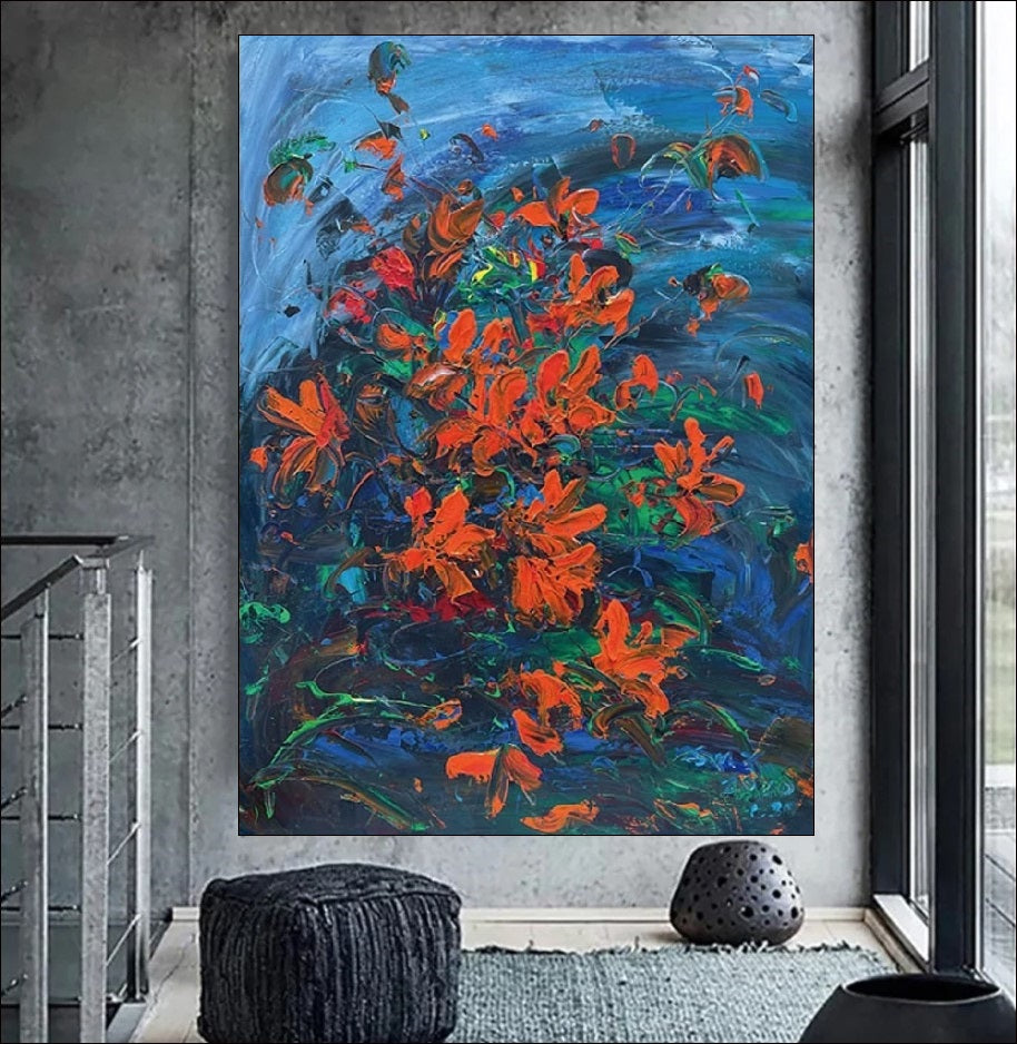 Handmade painting of red flowers on a blue background with textured brushstrokes, perfect for nature-inspired decor.
