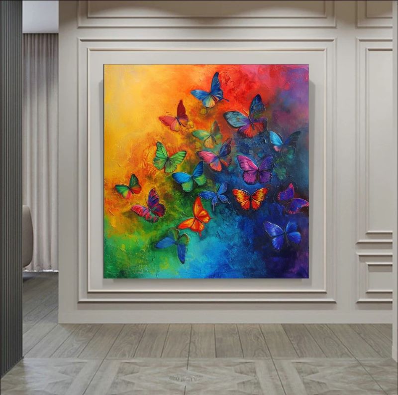 Vibrant painting of a swarm of colorful butterflies flying upwards against a yellow, orange, and blue rainbow gradient background, colorful nature wall art.
