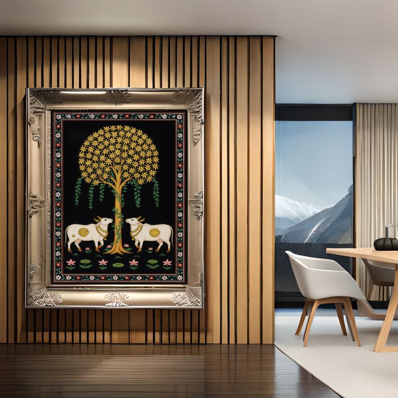 Traditional Pichwai painting featuring two white sacred cows standing under a golden Tree of Life on a black background with floral borders, Indian folk art.