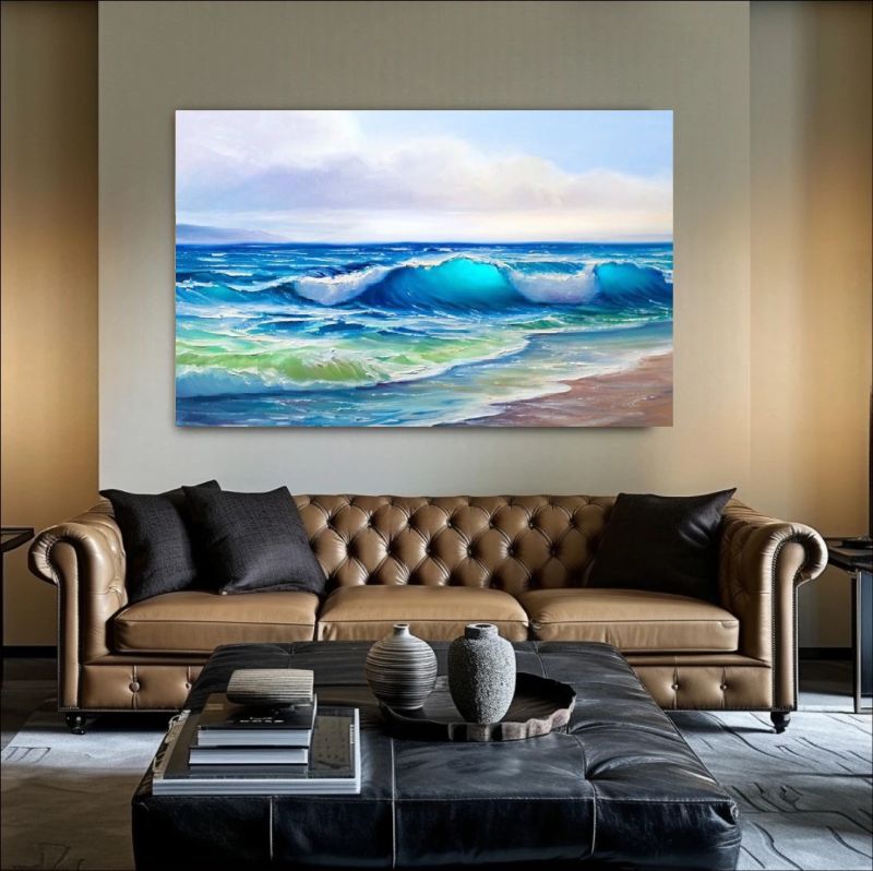 Modern living room with a beige sofa, colorful pillows, and a large framed artwork of a beach scene.