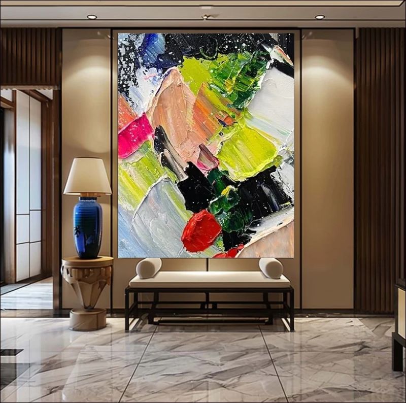 Vibrant abstract painting featuring chaotic impasto strokes of neon green, bright red, yellow, and black, modern expressionist wall art style.