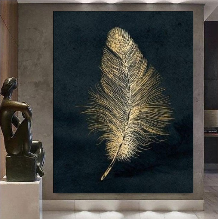 Gold feather art print on a dark background