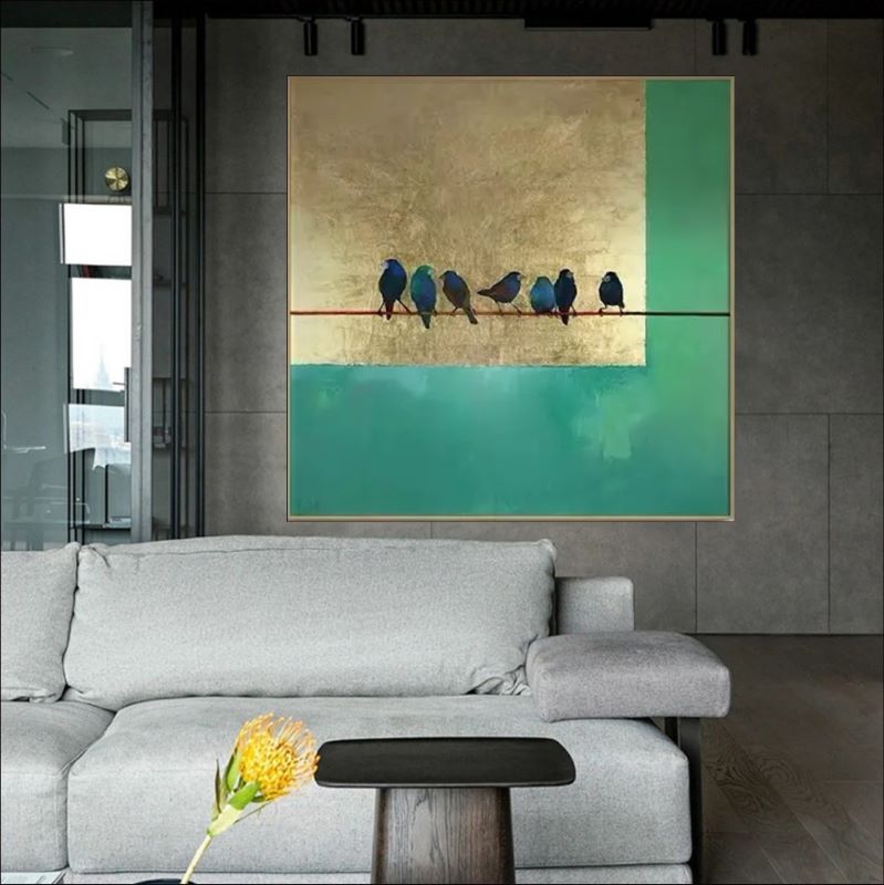Minimalist painting of small blue birds perched on a thin wire against a background of textured gold leaf and deep teal green blocks.