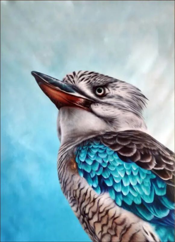 Realistic oil painting portrait of a Kookaburra bird featuring vibrant turquoise blue wing feathers and detailed plumage against a soft blue background.