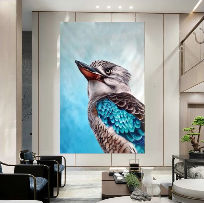 Realistic oil painting portrait of a Kookaburra bird featuring vibrant turquoise blue wing feathers and detailed plumage against a soft blue background.