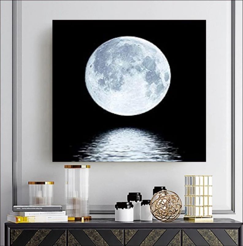 Realistic painting of a bright white full moon reflecting on dark rippling water against a pitch-black background, serene night landscape art.