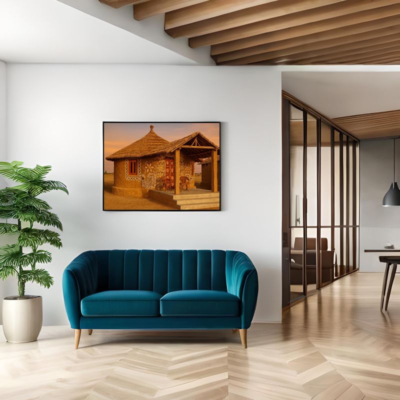 Traditional Rajasthani mud house painting featuring intricate white folk art motifs, floral mandalas, and a thatched roof, rustic Indian village wall decor.