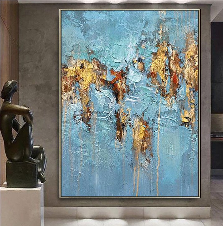 Abstract artwork featuring a textured design with vibrant blue tones and luxurious gold accents, creating a modern and elegant visual appeal.