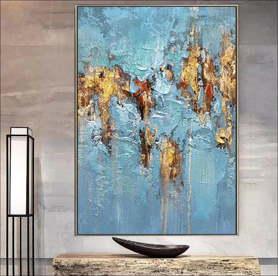 Abstract artwork featuring a textured design with vibrant blue tones and luxurious gold accents, creating a modern and elegant visual appeal.