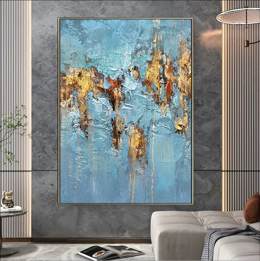 Abstract artwork featuring a textured design with vibrant blue tones and luxurious gold accents, creating a modern and elegant visual appeal.