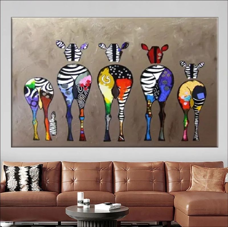Colorful abstract zebra painting on a wall above a dining table with tea set.