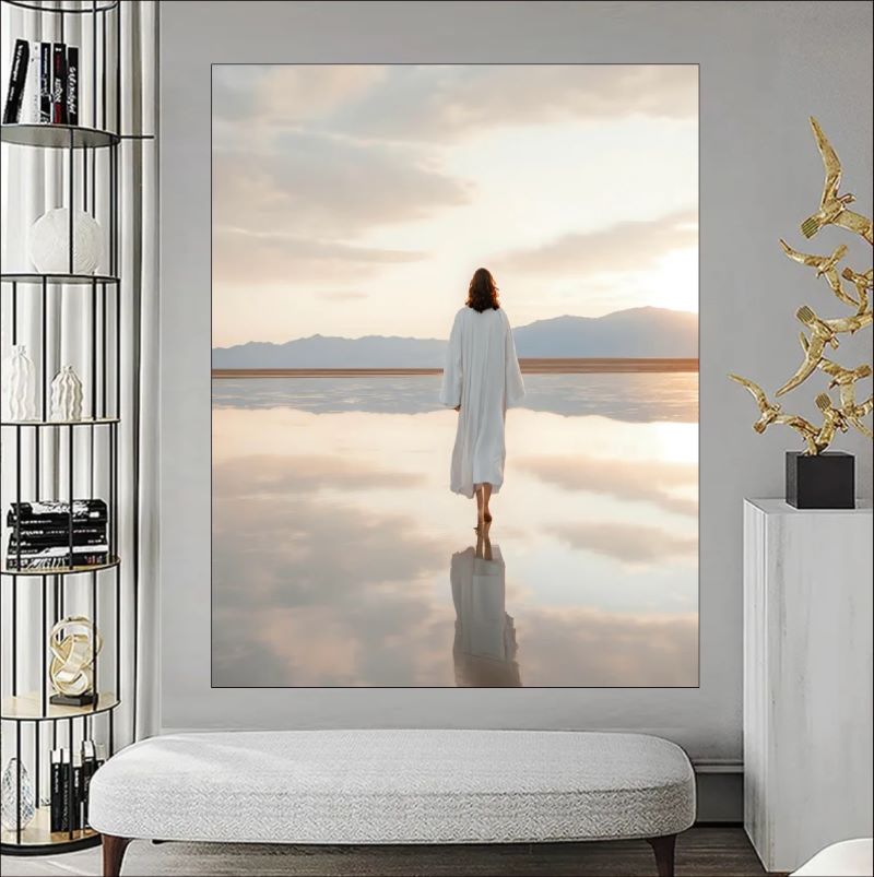 Painting of a figure in white robes walking on a reflective water surface under a soft pastel sky, spiritual Christian wall art style.