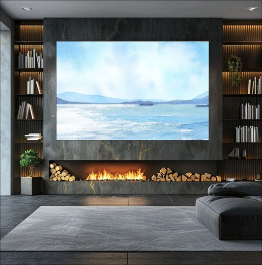Modern living room with a large TV displaying a scenic image, fireplace, and bookshelves.