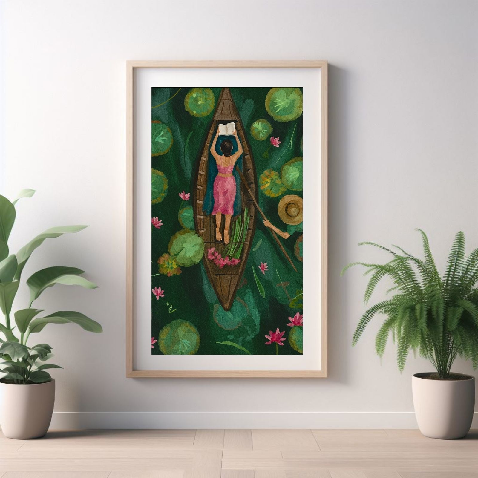 An aerial view watercolor painting of a woman in a pink dress reading a book in a wooden boat, surrounded by green lily pads and pink lotus flowers.