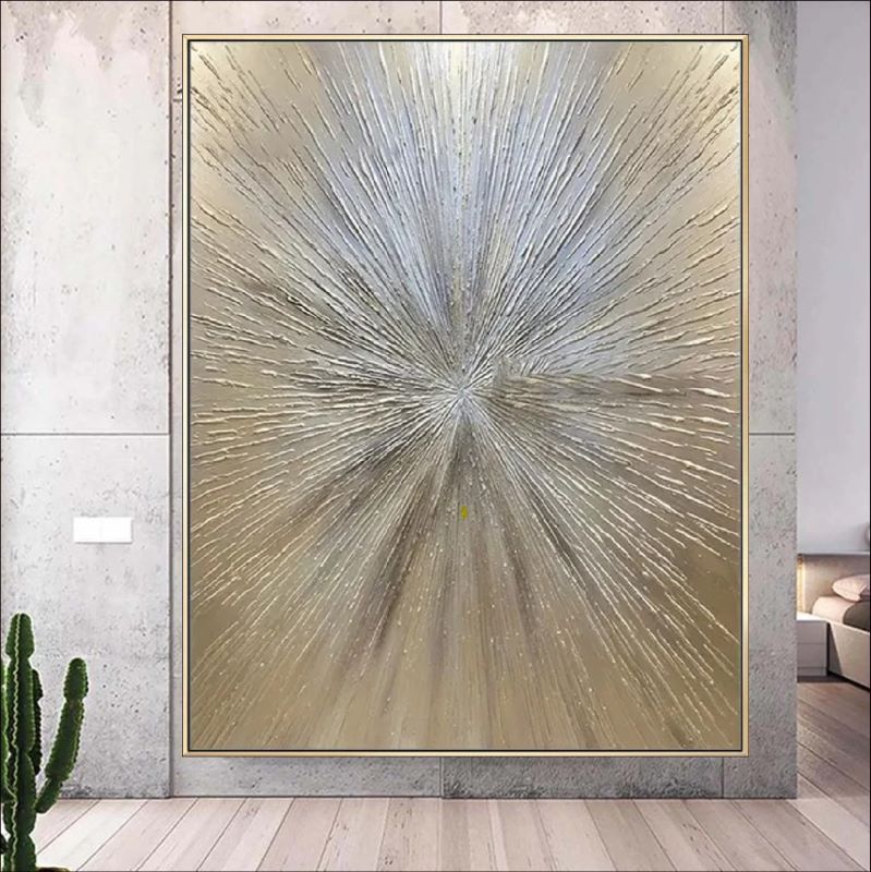 Decorative wall art with a starburst design in a modern interior setting.