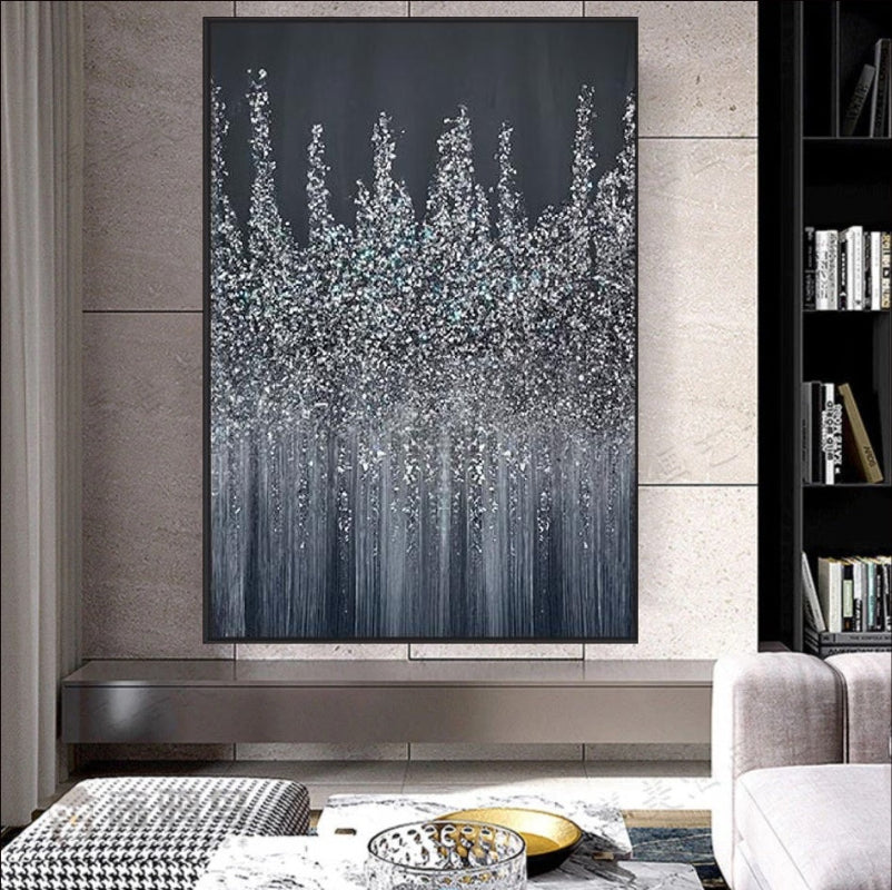 An abstract painting featuring a silver, glittering skyline against a dark midnight background. The artwork showcases a textured design with cascading metallic accents, evoking a sense of elegance and modernity