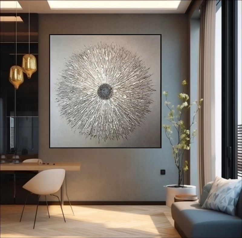 Textured abstract painting featuring a radiant starburst design with raised metallic lines in silver and champagne gold on a neutral background, modern luxury wall art.