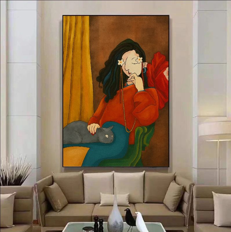 Framed abstract painting of a woman with a cat on a wall in a living room. ideal for modern figurative wall art and boho home decor.