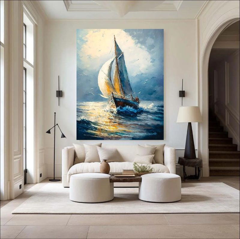 Living room with a large painting of a sailboat on the wall